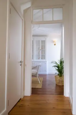 an empty hallway with a door leading to a living room at Casa Do Mercado by Heart of Funchal in Funchal