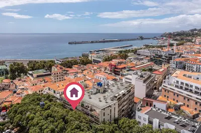 an aerial view of a city with a red arrow sign at Flat with Balcony at Downtown by Farmers Market in Funchal