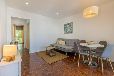 a living room with a couch and a table at Flat with Balcony at Downtown by Farmers Market in Funchal