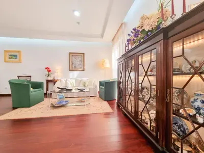 a living room with a couch and a table at Casa da Ladeira in Fajã da Ovelha