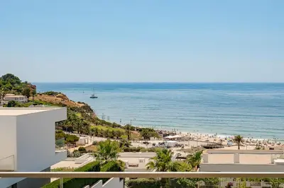 a view of the beach and the ocean from a building at Porto de Mos Golf & Beach B&B AL-40312 in Lagos