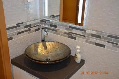 a bathroom with a bowl sink on a counter at Porto de Mos Golf & Beach B&B AL-40312 in Lagos