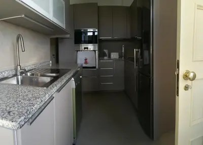 a kitchen with a sink and a refrigerator at Funchal Apartament Marina View with PARKING FREE in Funchal