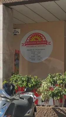 a motorcycle dealership with a sign on the wall with plants at Funchal Apartament Marina View with PARKING FREE in Funchal