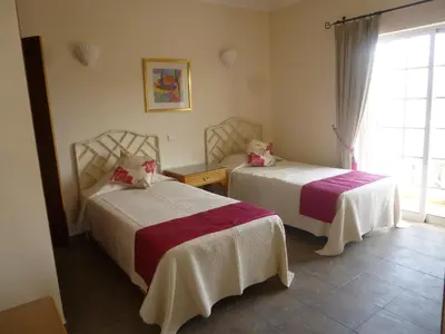 two beds in a room with a window at GUADALUPE 3 in Luz