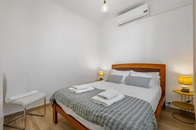 a bedroom with a bed with two towels on it at Navio Azul Apartment in Funchal