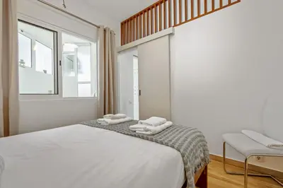 a bedroom with a bed with two towels on it at Navio Azul Apartment in Funchal