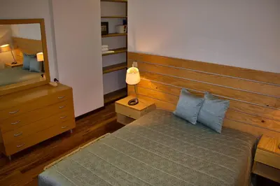 a bedroom with a bed and a mirror at Quinta Tallinus in Funchal