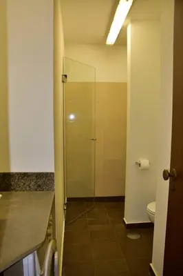 a bathroom with a shower and a toilet at Quinta Tallinus in Funchal