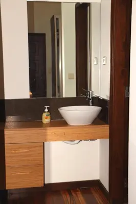 a bathroom counter with a sink and a mirror at Quinta Tallinus in Funchal