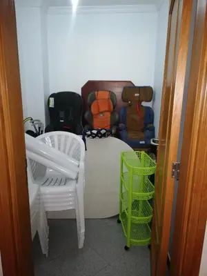 a room with a table and chairs and a couch at Imaculado Village in Funchal