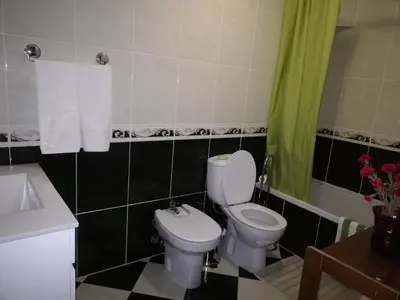 a bathroom with a toilet and a sink at Imaculado Village in Funchal