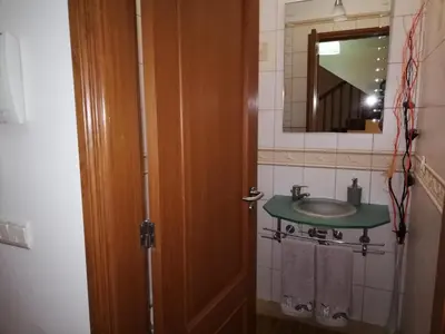 a bathroom with a sink and a mirror at Imaculado Village in Funchal