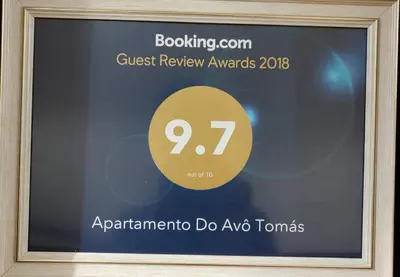 a framed picture of a sign for the guest review awards at Apartamento do Avô Tomás in Madalena do Mar
