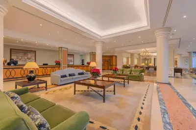 a large living room with couches and a table at Pestana Royal All Inclusive Ocean & Spa Resort in Funchal