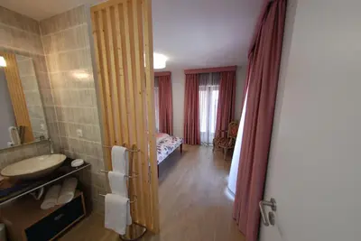 a room with a bathroom with a sink and a mirror at Serenity in Jardim do Mar