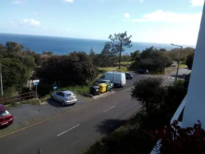 a street with cars parked on the side of a road at Apartamentos Matur in Machico