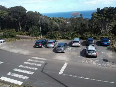 a bunch of cars parked in a parking lot at Apartamentos Matur in Machico