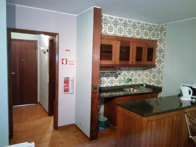 a kitchen with a sink and a counter top at Apartamentos Matur in Machico