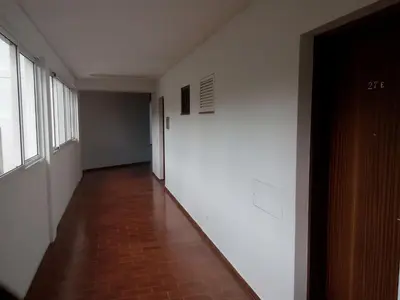 an empty hallway with a brick floor and white walls at Apartamentos Matur in Machico