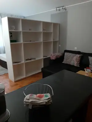 a living room with a black table and a couch at Apartamentos Matur in Machico