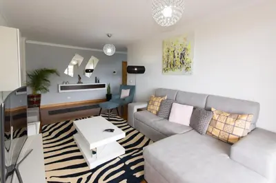 a living room with a couch and a table at Palace II in Funchal