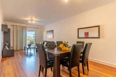 a dining room with a table and chairs at Virtudes Ocean view with pool by Holiday Rental Madeira in Funchal