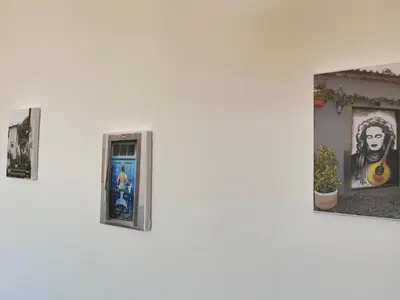 a group of pictures on a white wall at FLH Garajau Balcony with Pool in Caniço