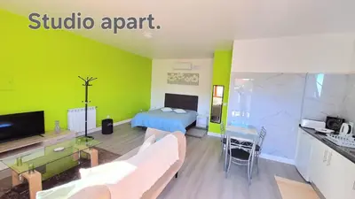 a living room with a couch and a bed at Discovery Apartment in Santana
