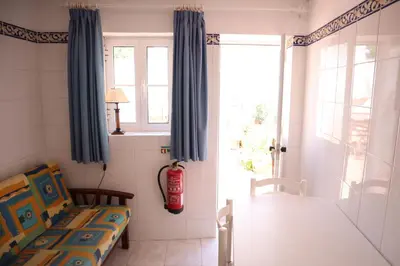 a room with a bed and a window at Salema Beach Private Villa in Salema