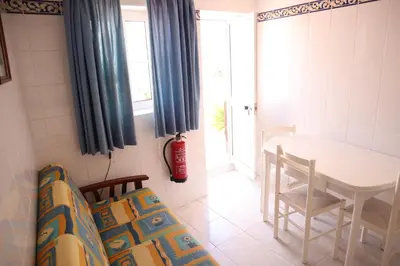 a room with a table and a table and chairs at Salema Beach Private Villa in Salema