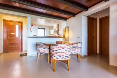 a dining room with a table and chairs at Mar da Luz in Luz