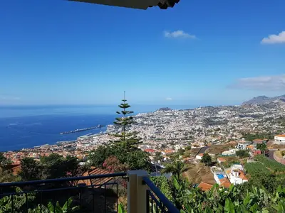 a view of a city from a balcony at Apartment with beautiful ocean and city view in Funchal