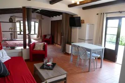 a living room with a couch and a table with chairs at Quinta Falzina in Luz