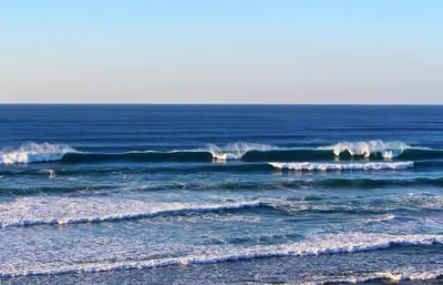 a group of breaking waves in the ocean at Sagres Sunny Room with private bathroom 300m from the beach in Sagres