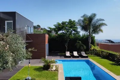 a swimming pool in the backyard of a house at Villa Ravenala - by LovelyStay in Funchal