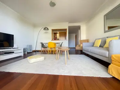a living room with a couch and a table at Quinta Falesia Apartment in Funchal