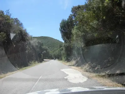 a view from the side view mirror of a road at Casa Riqueta Silva in Bordeira