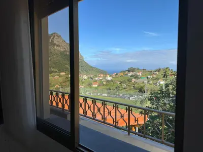 a view from a window of a balcony at Pereira's house - Mountain & Sea in Porto da Cruz