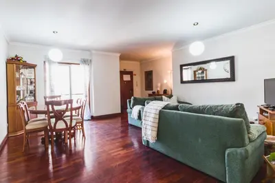 a living room with a couch and a table at Funchal Downtown by ALMA Holiday Rentals in Funchal