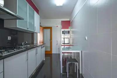 a glass table with two chairs and a mirror at Sunset Apartment by Holiday Rental Madeira in Funchal