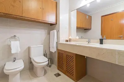 a bathroom with a toilet and a sink at Ajuda II by An Island Apart in Funchal