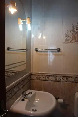 a bathroom with a sink and a mirror at OCEANUS ROOM With private kitchen, bathroom and terrace 300m from the beach in Sagres