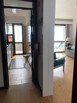 a living room with a door open to a living room at Bahia Top Floor in Funchal