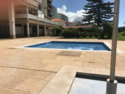 a swimming pool in front of a building at Bahia Top Floor in Funchal