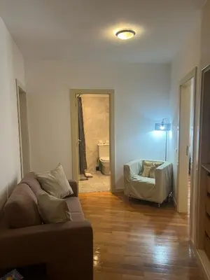 a living room with a couch and a bathroom at Rocha Mar 3M in Ribeira Brava