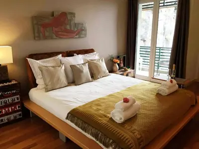 a bedroom with a bed with two towels on it at Rocha Mar 3M in Ribeira Brava