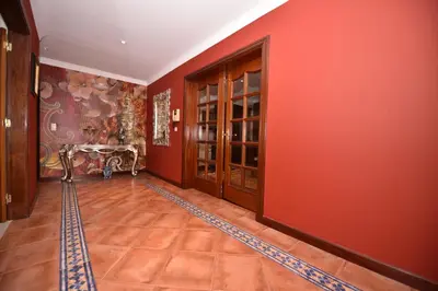 a hallway with red walls and a red wall at Villa Santana in Funchal
