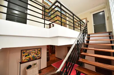 a staircase leading up to the second floor of a house at Villa Santana in Funchal