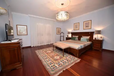 a bedroom with a bed and a television in it at Villa Santana in Funchal
